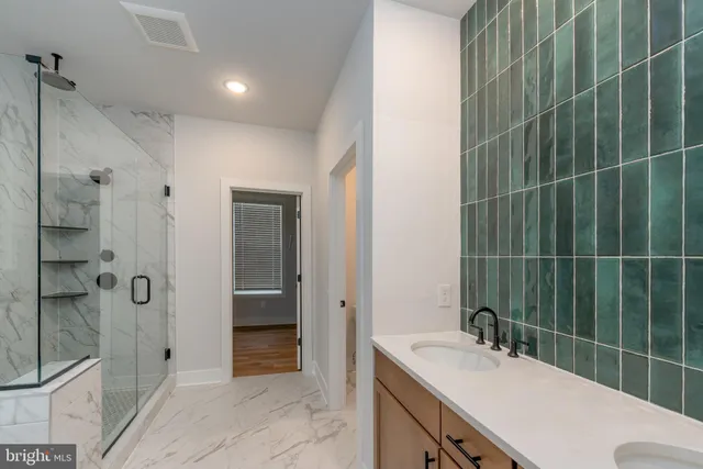a bathroom with a toilet sink and shower