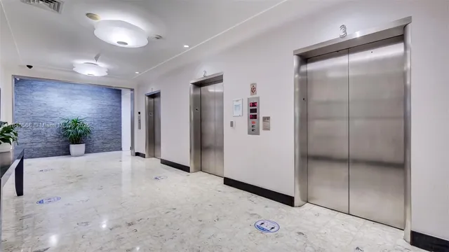 a view of a hallway with wooden shelves