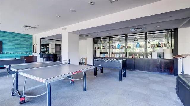 a room with furniture and a floor to ceiling window