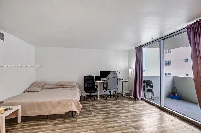 a bedroom with a bed and a chair