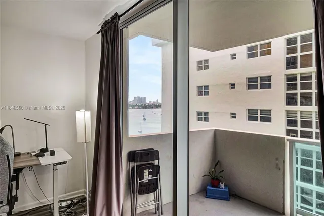a view of a bathroom with a tub and shower