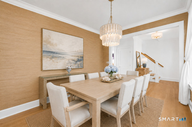 920 Old Post Road Fairfield, CT 06824 - Photo 4 of 40 The dramatic Dining Room has a beautiful shell-like chandelier and finished in textured grasscloth wall covering. VIRTUALLY STAGED