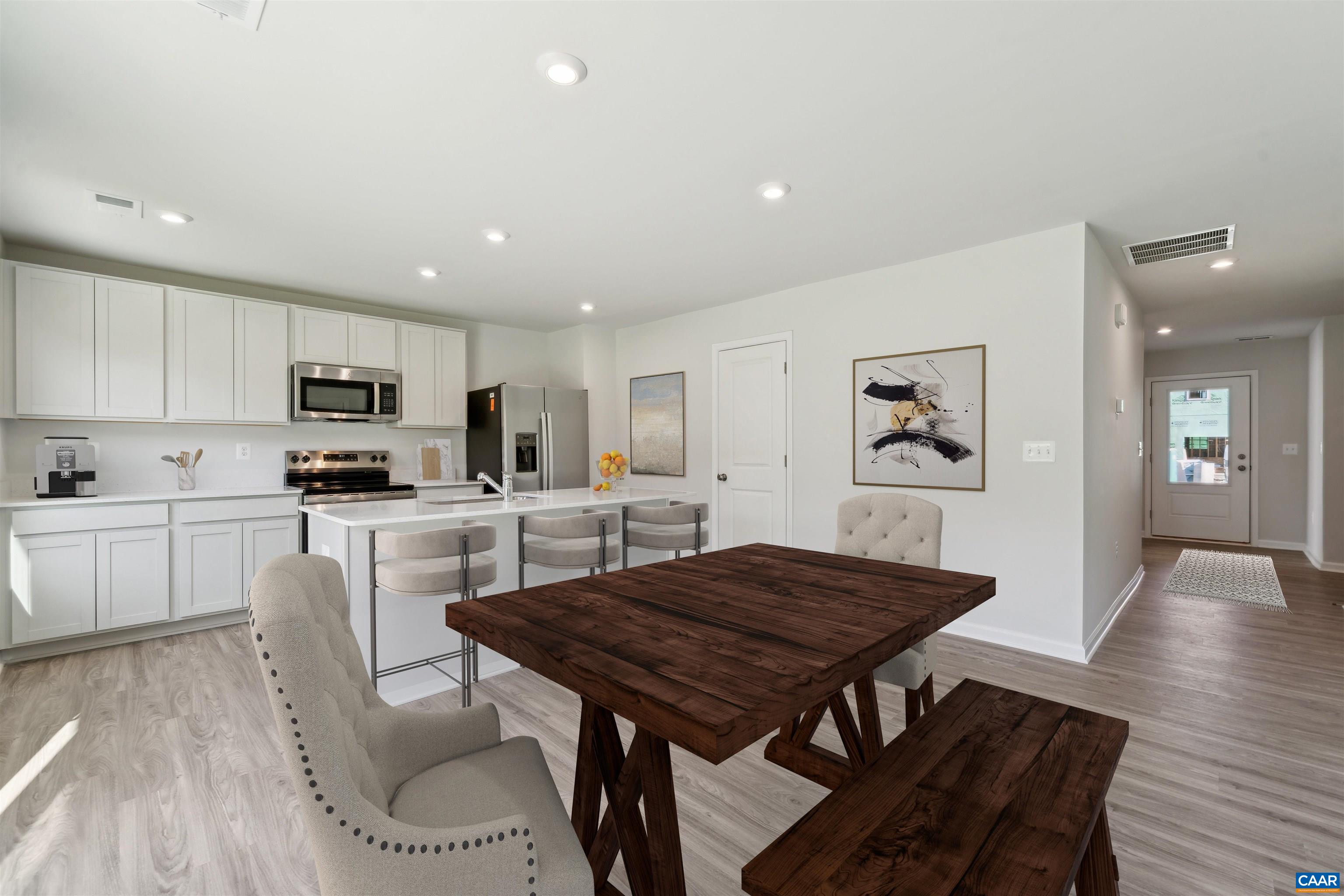 348 Trailfork Road Barboursville, VA 22923 - Photo 7 of 40 a kitchen with a table and chairs in it