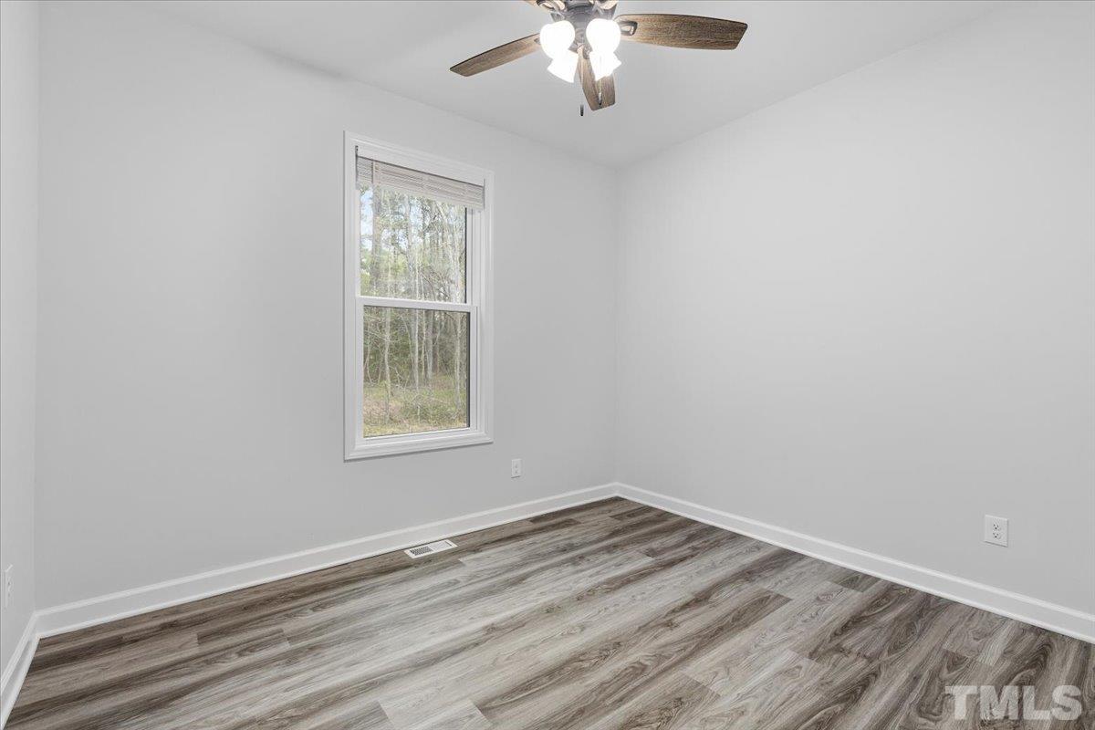 1893 Pilot-Riley Road Zebulon, NC 27597 - Photo 27 of 50 an empty room with a window