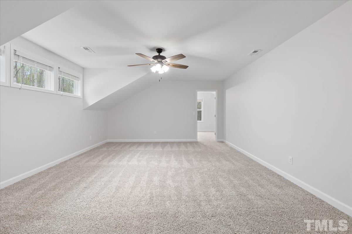 1893 Pilot-Riley Road Zebulon, NC 27597 - Photo 38 of 50 a view of an empty room with a fan