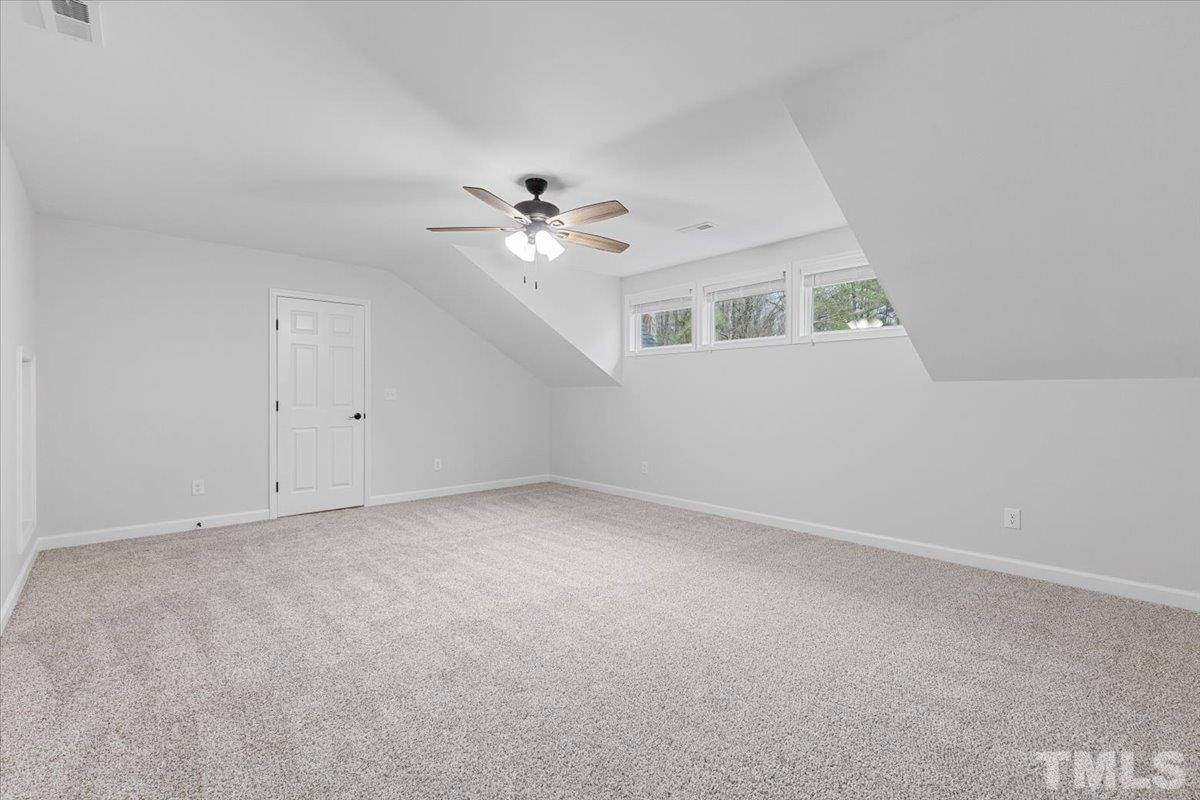 1893 Pilot-Riley Road Zebulon, NC 27597 - Photo 40 of 50 a view of an empty room with a ceiling fan and window