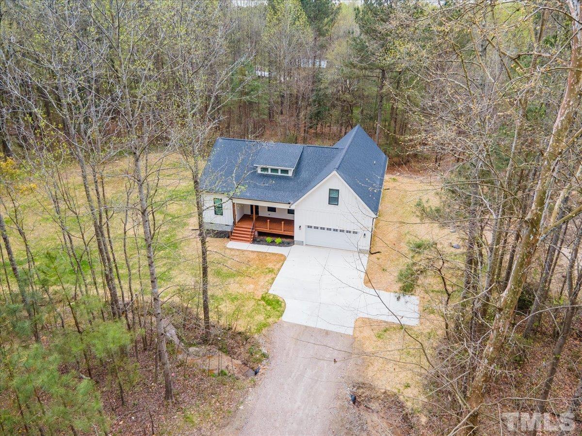 1893 Pilot-Riley Road Zebulon, NC 27597 - Photo 4 of 50 a front view of a house with a yard