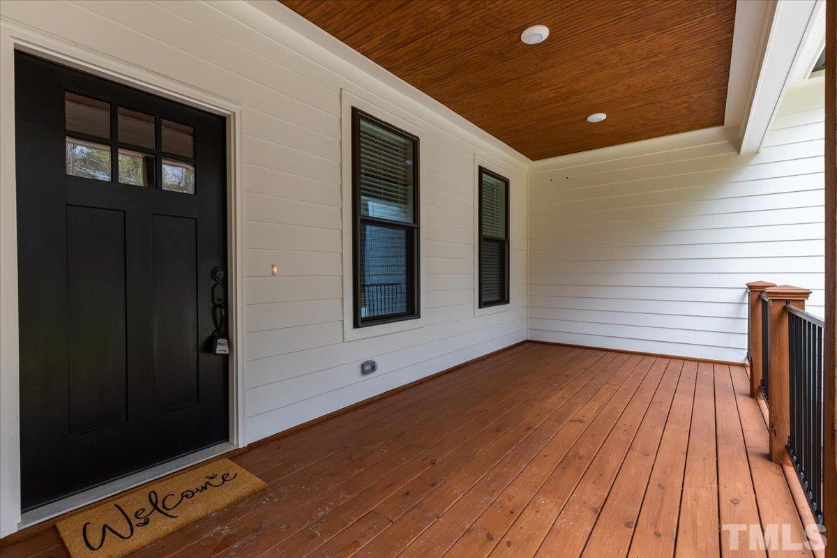 1893 Pilot-Riley Road Zebulon, NC 27597 - Photo 6 of 50 a view of an empty room with wooden floor and a window