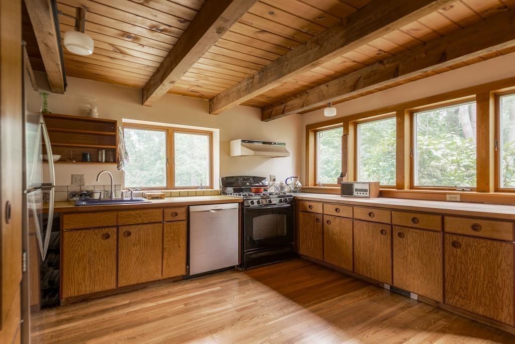 190 Argilla Road Ipswich, MA 01938 - Photo 12 of 40 a large kitchen with a large window and stainless steel appliances