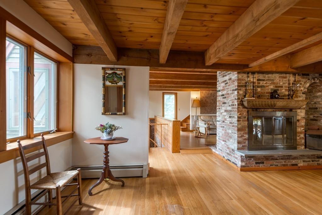 190 Argilla Road Ipswich, MA 01938 - Photo 10 of 40 a living room with furniture a wooden floor and next to a window
