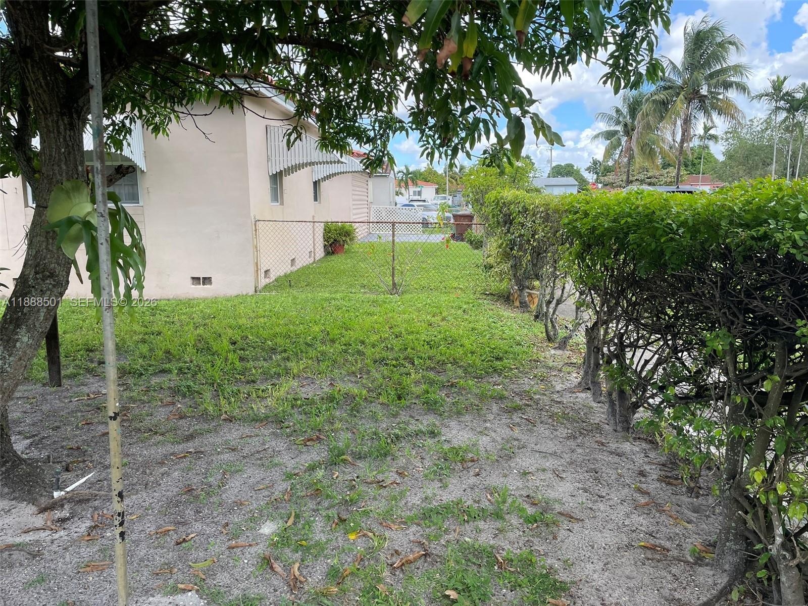 265 West 55th Street Hialeah, FL 33012 - Photo 14 of 58 a view of a house with a yard