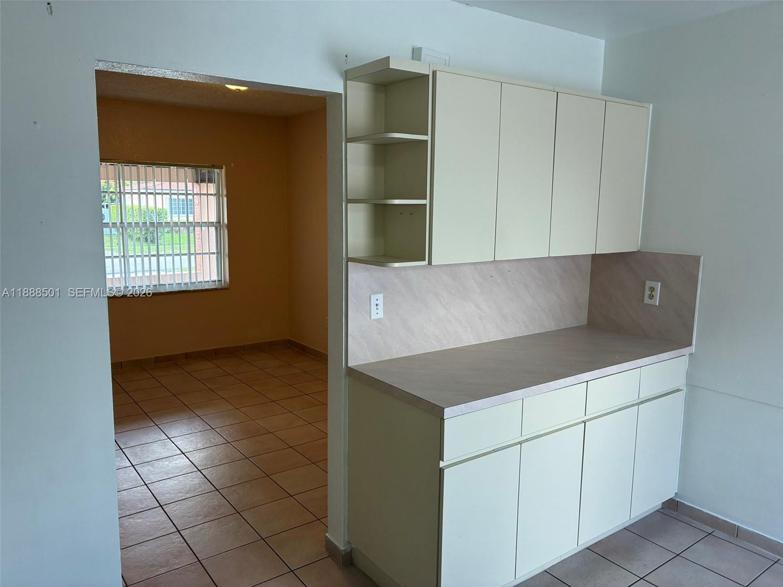265 West 55th Street Hialeah, FL 33012 - Photo 20 of 58 a kitchen with a cabinets and window
