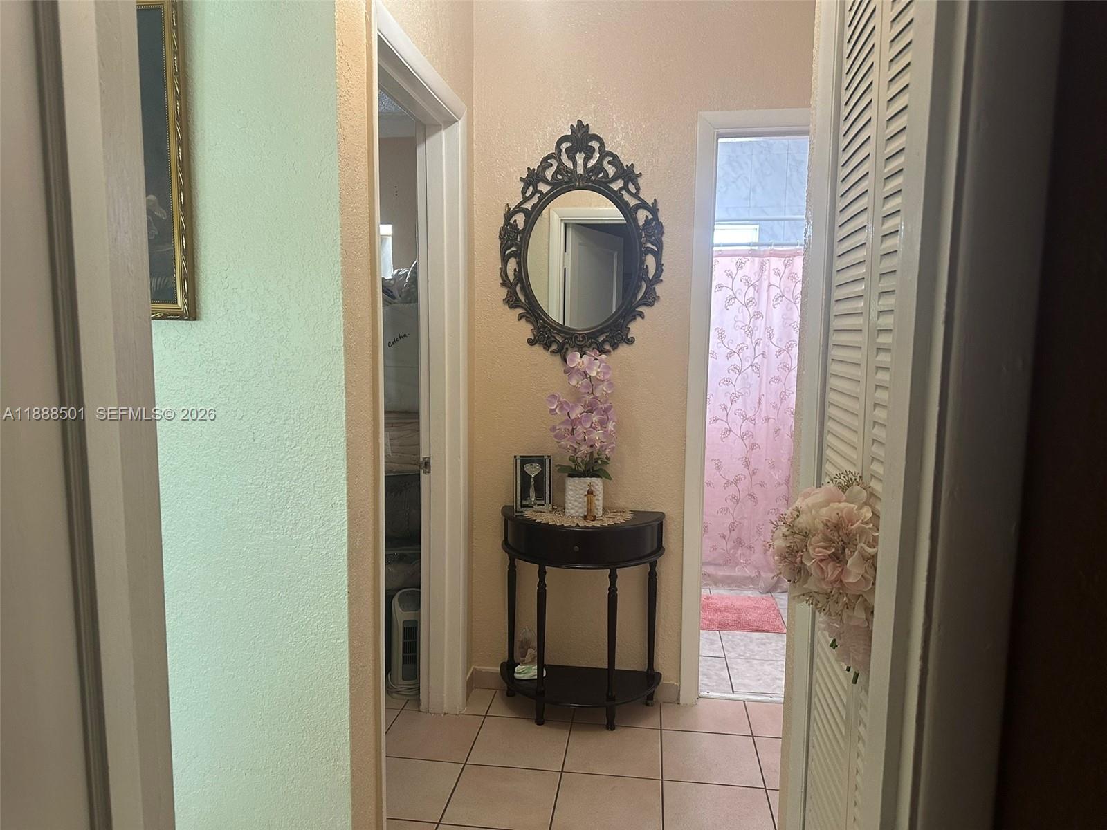 265 West 55th Street Hialeah, FL 33012 - Photo 23 of 58 a bathroom with a sink and a mirror