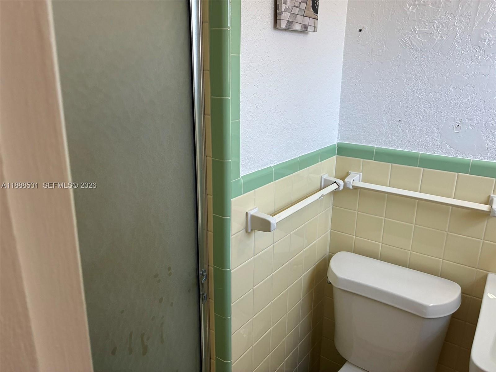 265 West 55th Street Hialeah, FL 33012 - Photo 30 of 58 a bathroom with a toilet and a shower