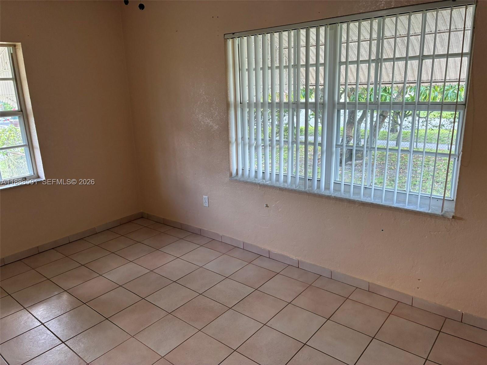 265 West 55th Street Hialeah, FL 33012 - Photo 33 of 58 a view of an empty room and window