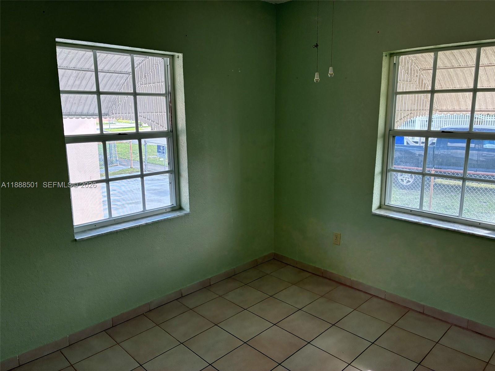 265 West 55th Street Hialeah, FL 33012 - Photo 38 of 58 an empty room with a window