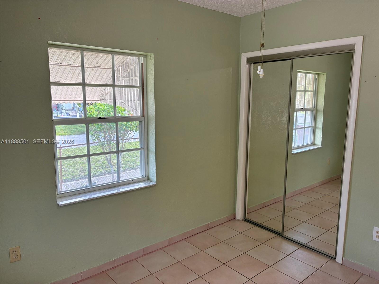 265 West 55th Street Hialeah, FL 33012 - Photo 39 of 58 an empty room that has a window in it