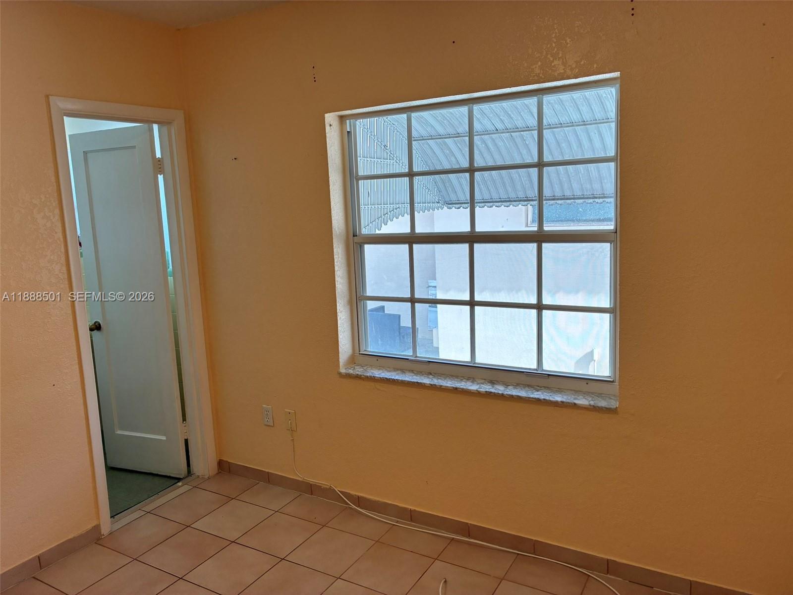 265 West 55th Street Hialeah, FL 33012 - Photo 42 of 58 an empty room with windows