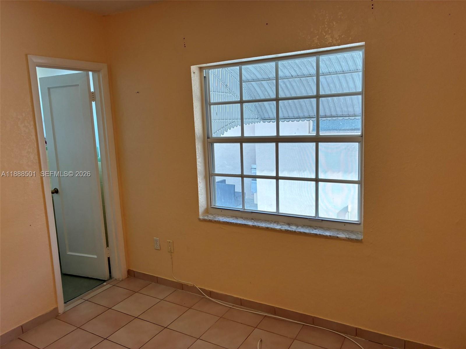 265 West 55th Street Hialeah, FL 33012 - Photo 43 of 58 an empty room with windows