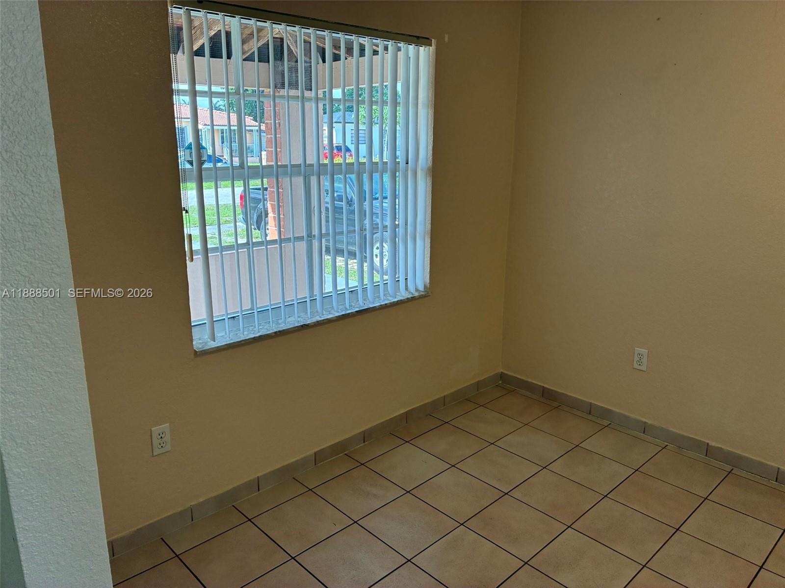 265 West 55th Street Hialeah, FL 33012 - Photo 48 of 58 a view of an empty room with wooden floor