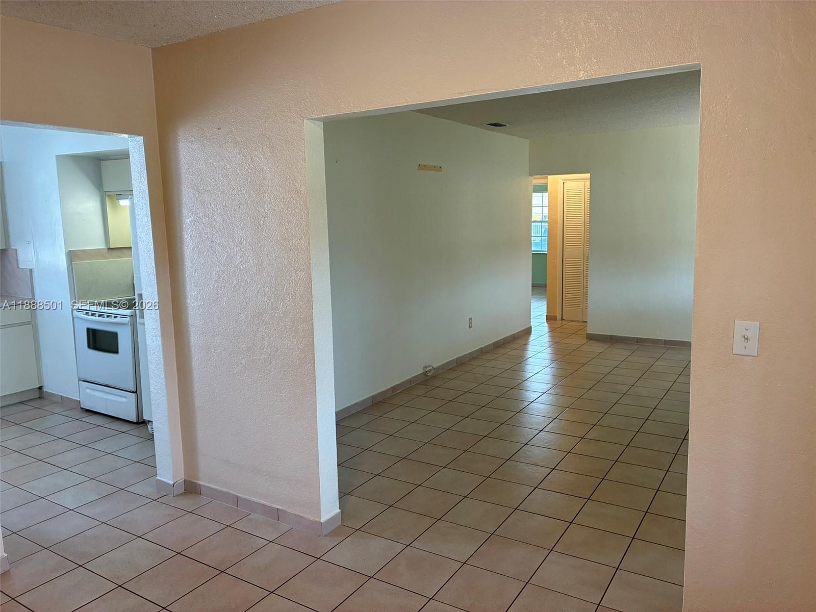 265 West 55th Street Hialeah, FL 33012 - Photo 49 of 58 an empty room with kitchen view