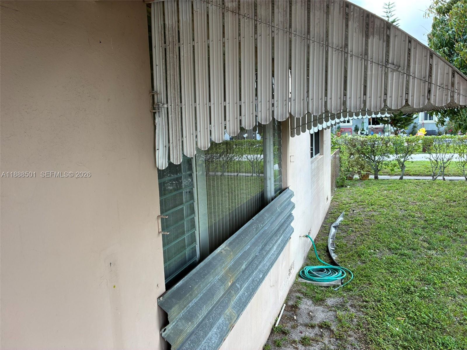 265 West 55th Street Hialeah, FL 33012 - Photo 55 of 58 a view of a backyard with chairs