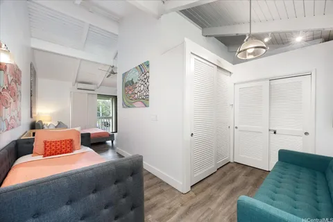 a bedroom with a bed and a couch