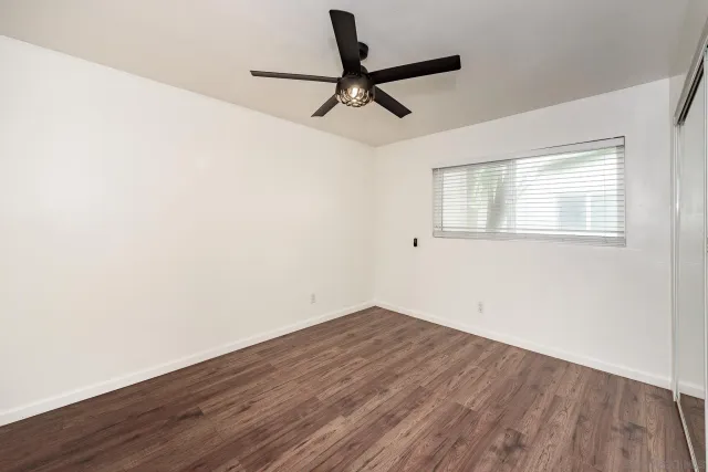 a view of a building with garden and sitting area