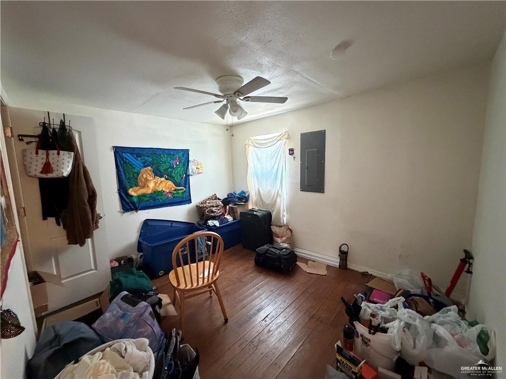 865 Rio Grande Street San Benito, TX 78586 - Photo 5 of 10 a living room with furniture and a flat screen tv