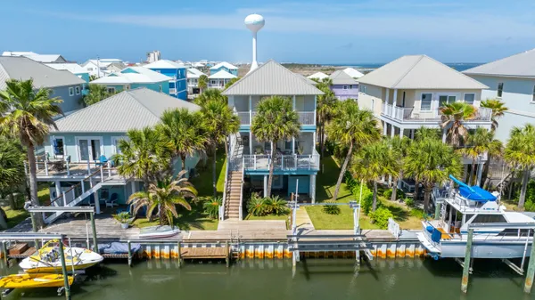 an aerial view of a house with outdoor space