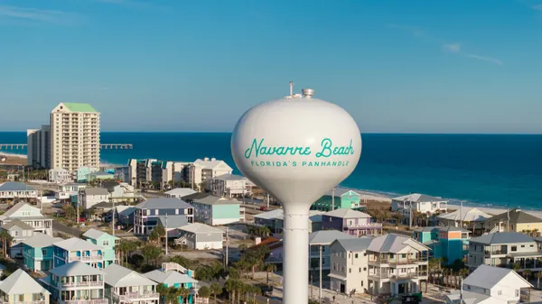 a view of a balcony with wooden floor