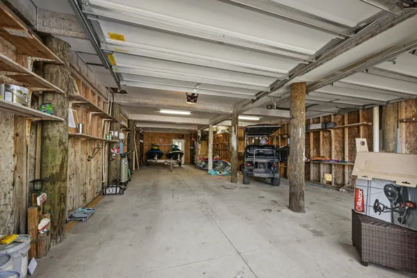 a view of a house with a yard and potted plants