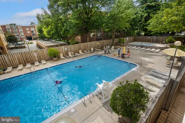 a view of swimming pool with a patio