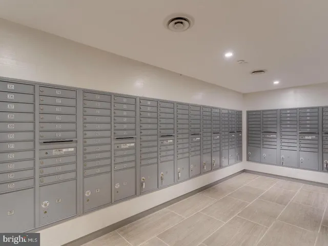 a view of a patio with table and chairs potted plants and large tree