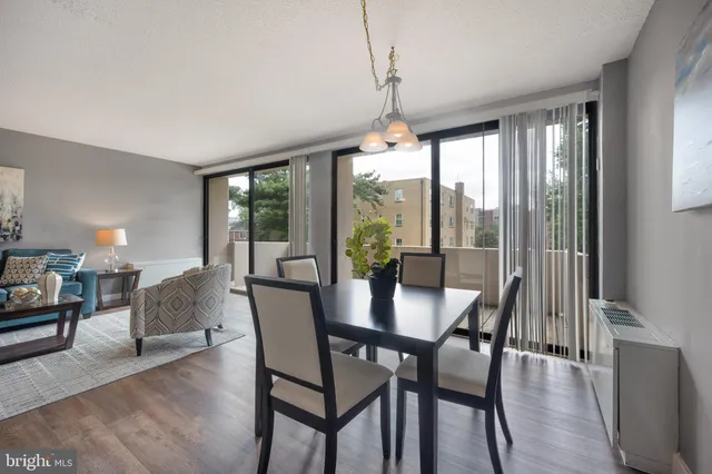 a view of a dining room with furniture window and wooden floor