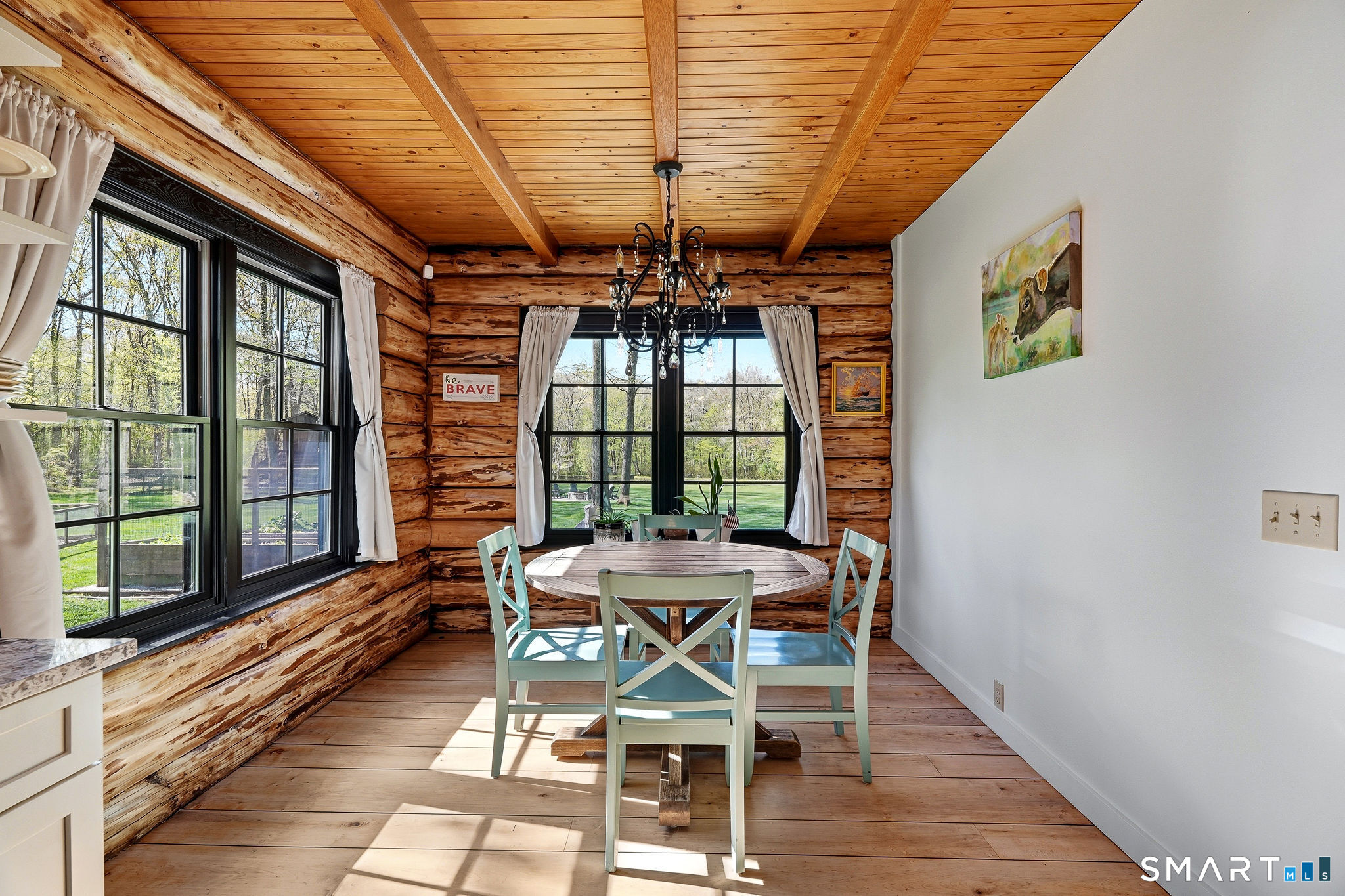 61 Mystic Road North Stonington, CT 06359 - Photo 18 of 40 a view of a dining room with furniture window and wooden floor