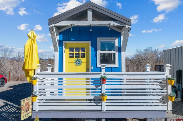 a view of a two chairs in the patio