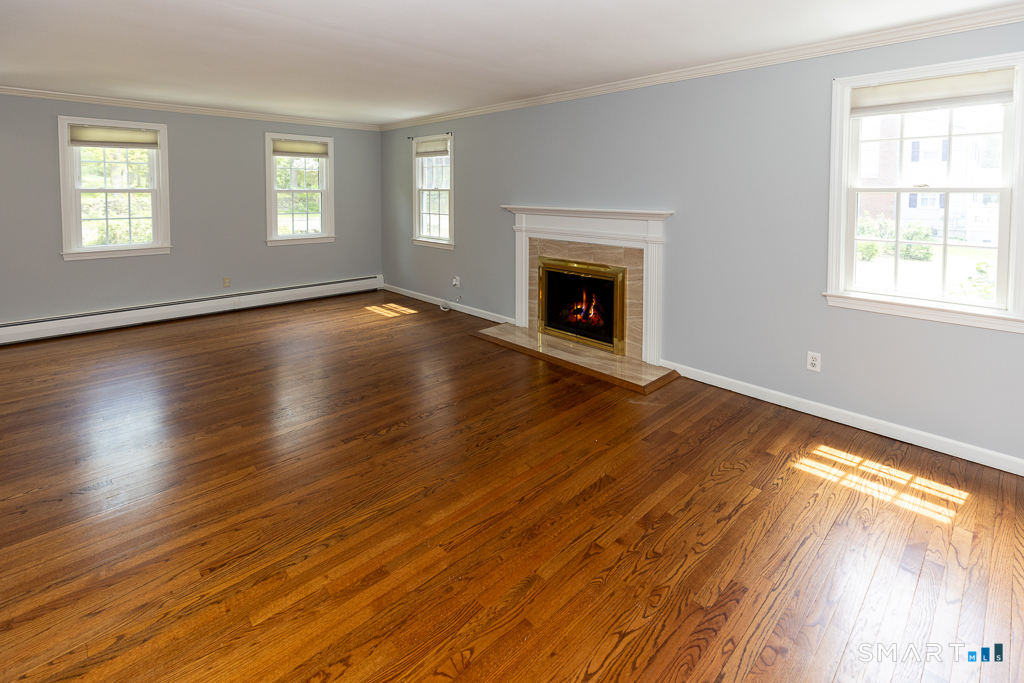 49 Kelseytown Road Clinton, CT 06413 - Photo 11 of 40 Front to back livingroom with fireplace and gorgeous hardwood floors
