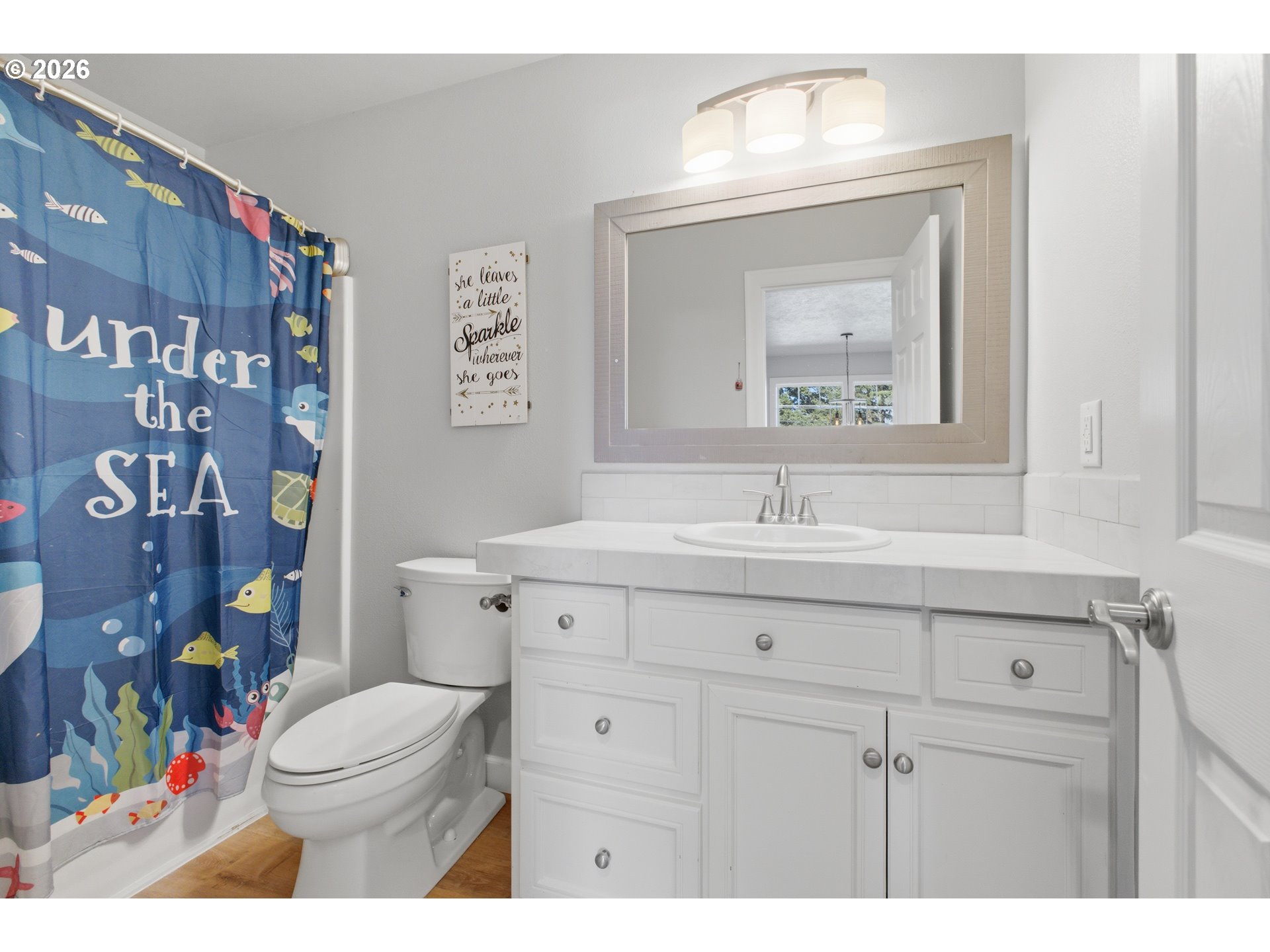 2925 Doaks Ferry Road Northwest Salem, OR 97304 - Photo 40 of 47 a bathroom with a toilet a sink and mirror