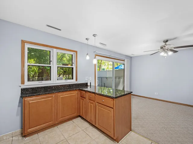 a kitchen with sink and window