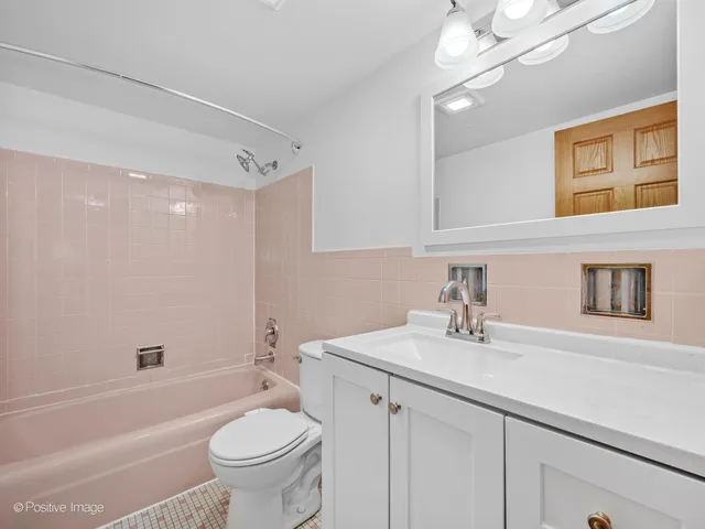 a bathroom with a sink a toilet and a bathtub