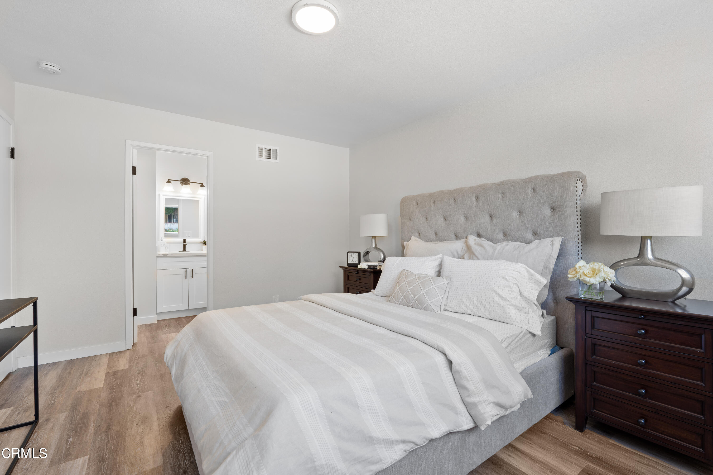 1007 Appleton Road Simi Valley, CA 93065 - Photo 15 of 29 a bedroom with a bed and a lamp on dresser