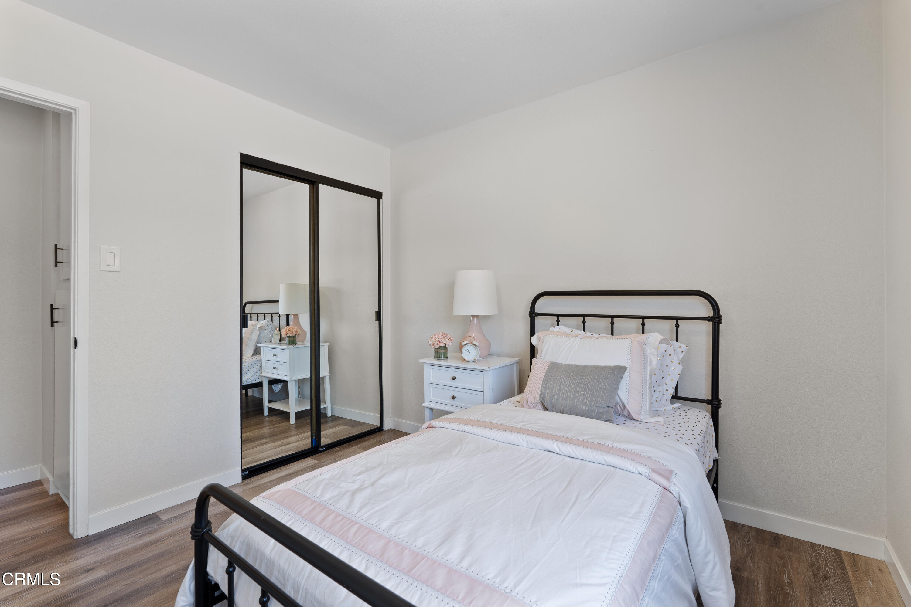 1007 Appleton Road Simi Valley, CA 93065 - Photo 17 of 29 a bedroom with a bed and wooden floor