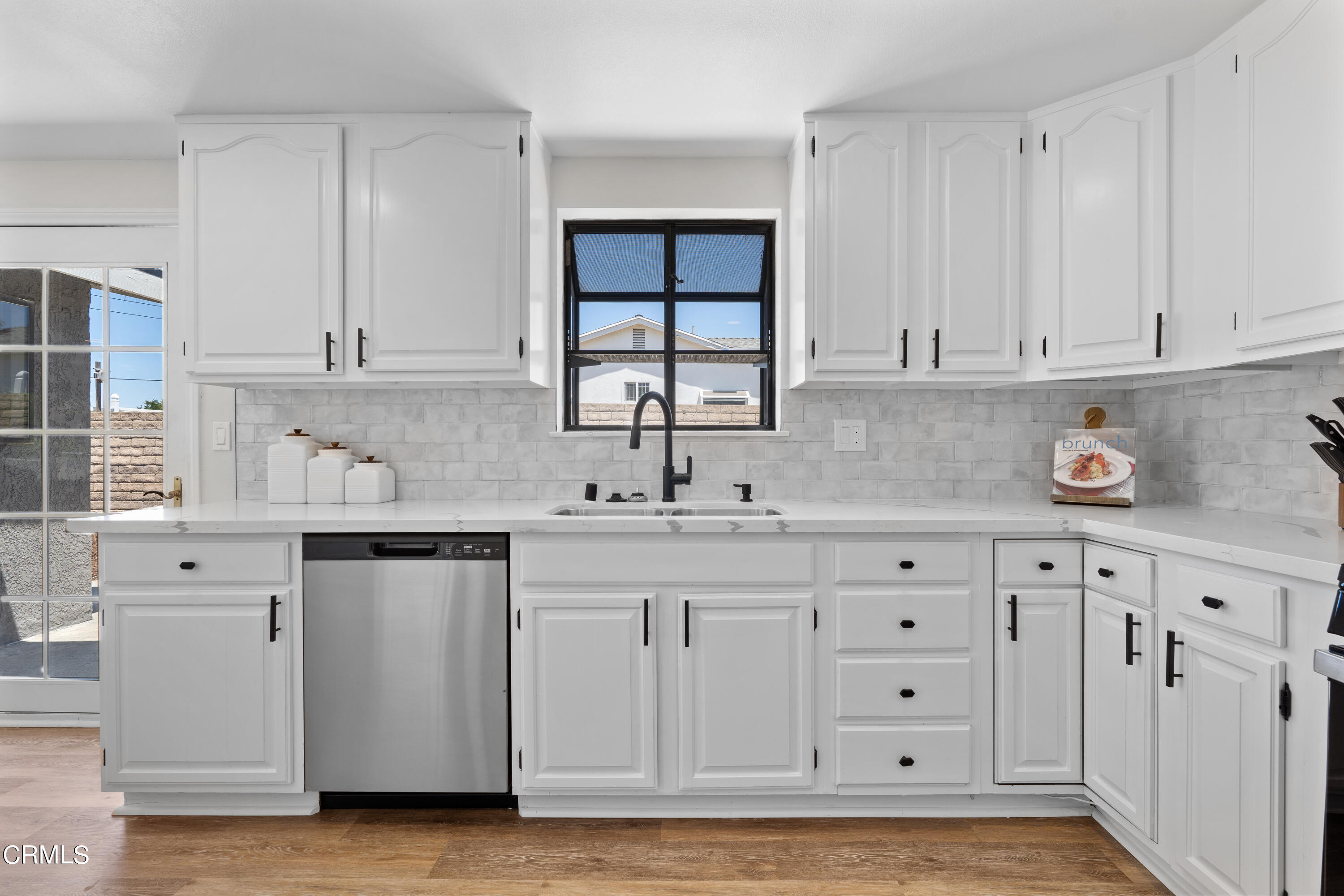 1007 Appleton Road Simi Valley, CA 93065 - Photo 9 of 29 a kitchen with granite countertop a sink cabinets and window