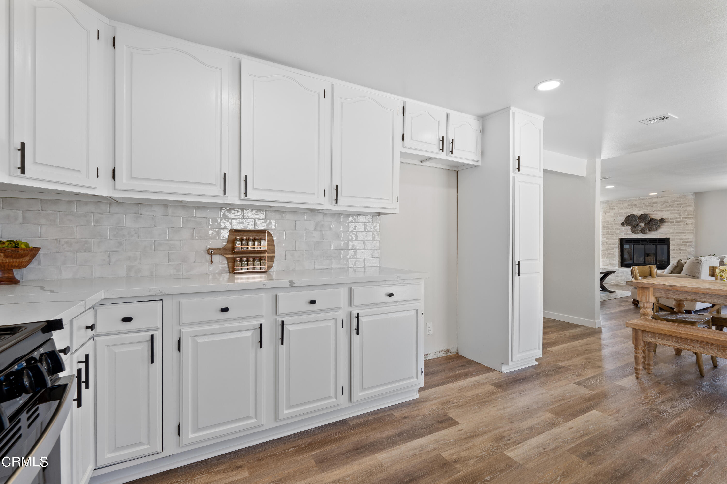 1007 Appleton Road Simi Valley, CA 93065 - Photo 10 of 29 a kitchen with white cabinets and appliances