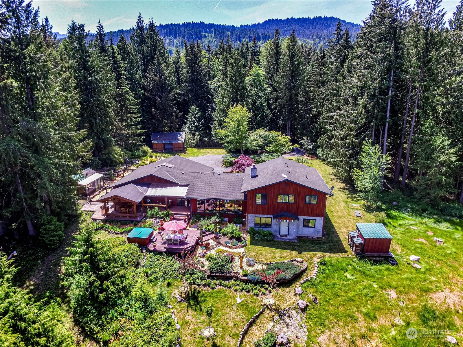 443 Westridge Road Port Angeles, WA 98363 - Photo 1 of 40 a view of a house with swimming pool and red chairs