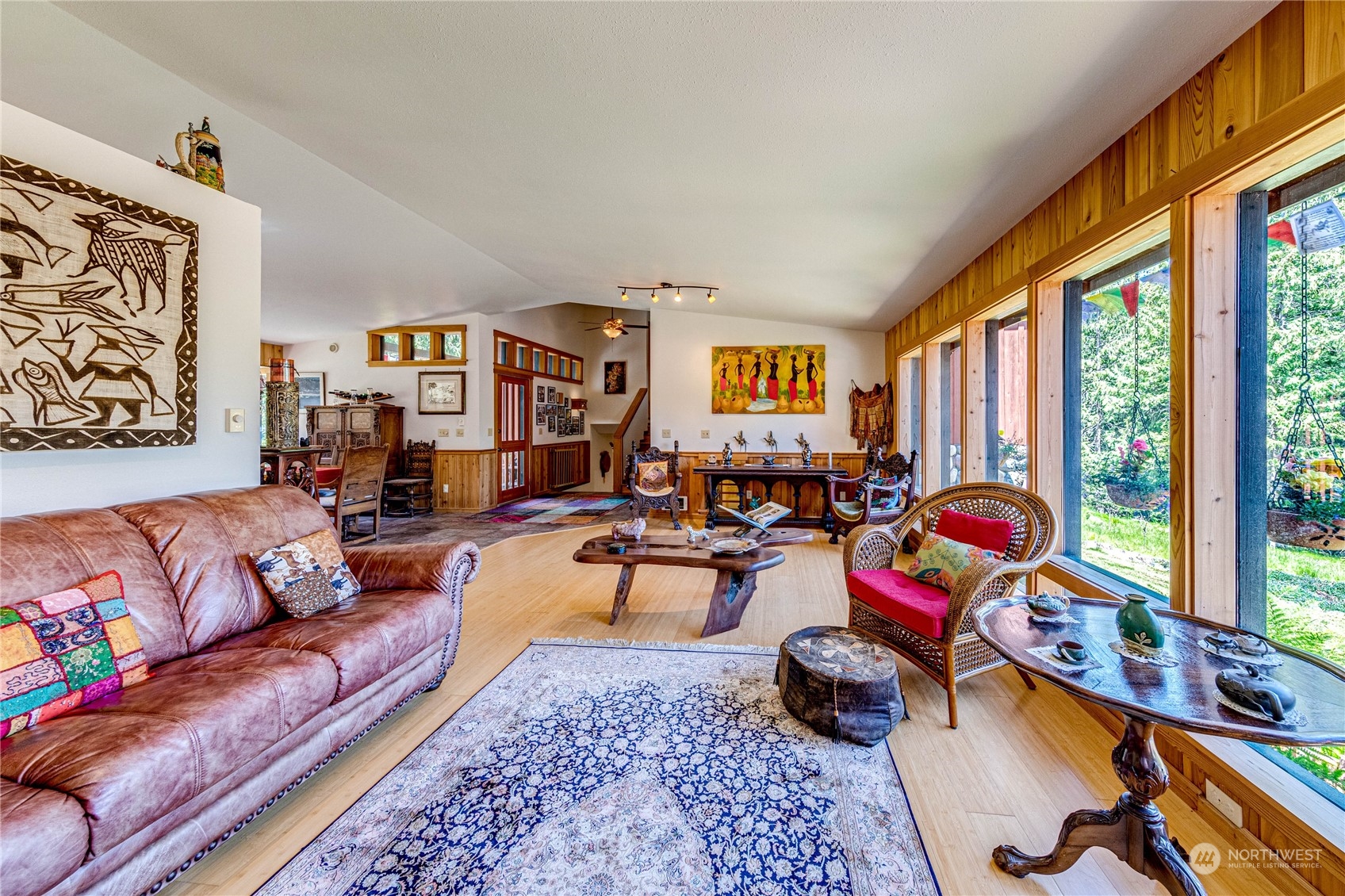 443 Westridge Road Port Angeles, WA 98363 - Photo 11 of 40 a living room with furniture flat screen tv and a large window