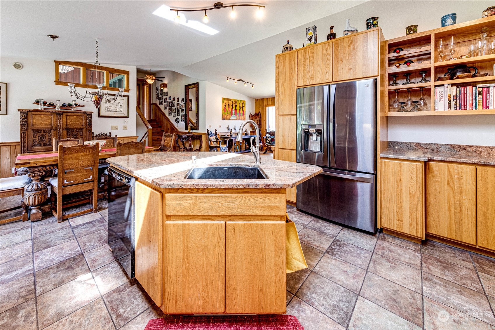 443 Westridge Road Port Angeles, WA 98363 - Photo 14 of 40 a kitchen with stainless steel appliances granite countertop a refrigerator a stove and a sink with cabinets