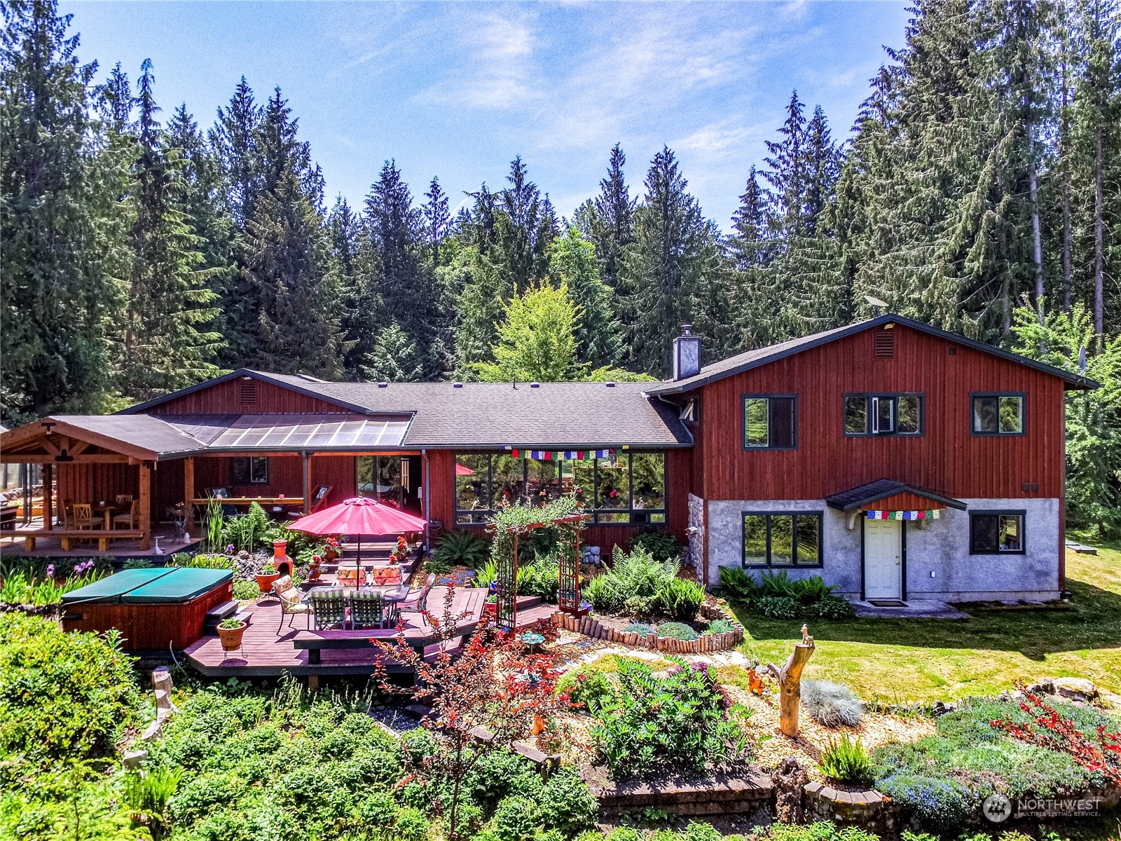 443 Westridge Road Port Angeles, WA 98363 - Photo 2 of 40 a view of a house with swimming pool and a yard
