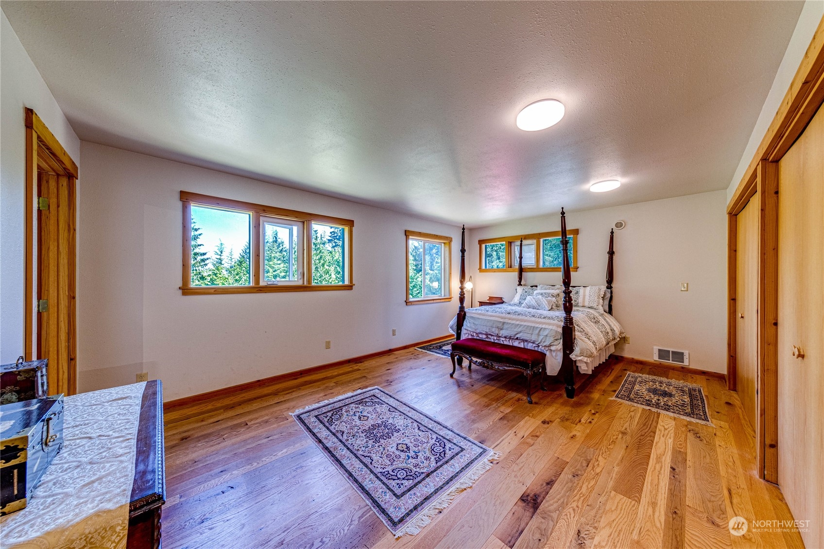 443 Westridge Road Port Angeles, WA 98363 - Photo 24 of 40 a bedroom with furniture and a wooden floor